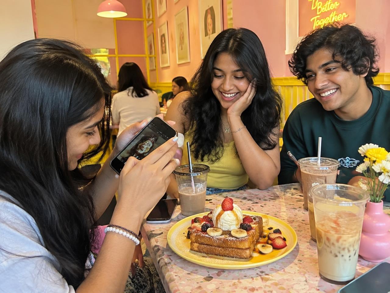 Friends snapping toast at Toastique